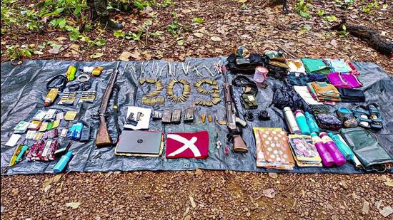 Arms, ammunition and other incriminating material recovered from a Maoist bunker in July. (PTI Photo)