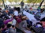 A group of migrants rest on a gazebo at a park after the deportees from the U.S. were pushed by Mexican authorities off an area they had been staying after their expulsion on March 20, 2021 (Pic for representation)