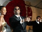 Sean "P. Diddy" Combs directs photographers as they sing "Happy Birthday," to him as his date Kim Porter, left, listens, after Combs arrived for his 35th birthday celebration at Cipriani on Wall Street in New York, Nov. 4, 2004. Sean "P. Diddy" Combs directs photographers as they sing "Happy Birthday," to him as his date Kim Porter, left, listens, after Combs arrived for his 35th birthday celebration at Cipriani on Wall Street in New York, Nov. 4, 2004.