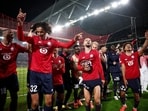 Lille's Tiago Santos and Ayyoub Bouaddi celebrate after the match