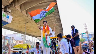 Congress candidate from Badshahpur Vardhan Yadav during a roadshow on the last day of the election campaign at Badshahpur Bazar in Gurugram on Thursday. (Parveen Kumar/HT PHOTO)