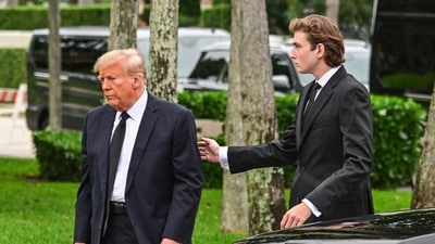 Former US President Donald Trump and his son Barron Trump attend the funeral of former first lady Melania Trump's mother Amalija Knavs, at Bethesda by the Sea Church, in Palm Beach, Florida, on January 18, 2023. The US Republican Party has named Donald Trump's 18 year-old son Barron as a Florida delegate to its national convention, propelling another member of the family into the spotlight. (Photo by GIORGIO VIERA / AFP) (AFP)