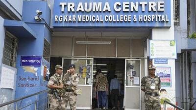Kolkata: CISF personnel stand guard outside the trauma centre of RG Kar Medical College and Hospital after junior doctors rejoined their duty partially, in Kolkata (PTI) Kolkata: CISF personnel stand guard outside the trauma centre of RG Kar Medical College and Hospital after junior doctors rejoined their duty partially, in Kolkata (PTI)
