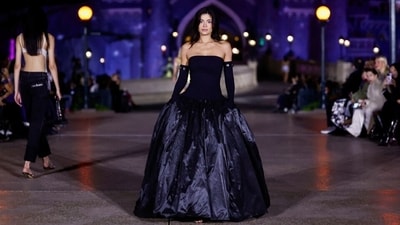 The Coperni show saw villains, mermaids, princesses, fireworks, and a special appearance by Kylie Jenner. The internet personality transformed into a gothic Disney Princess as she walked the ramp in an off-the-shoulder black gown with a voluminous skirt styled with Opera gloves. The Coperni show saw villains, mermaids, princesses, fireworks, and a special appearance by Kylie Jenner. The internet personality transformed into a gothic Disney Princess as she walked the ramp in an off-the-shoulder black gown with a voluminous skirt styled with Opera gloves. 