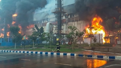 A fireman douses a fire breaking out at a chemical godown of the electronics component factory of Tata Electronics Pvt Ltd, in Hosur, Tamil Nadu. (PTI) A fireman douses a fire breaking out at a chemical godown of the electronics component factory of Tata Electronics Pvt Ltd, in Hosur, Tamil Nadu. (PTI)