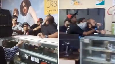 At one point in the video, a few KFC workers grab the man by the neck and keep him in a chokehold as another worker continues to hit him. (X/@Arhantt_pvt) At one point in the video, a few KFC workers grab the man by the neck and keep him in a chokehold as another worker continues to hit him. (X/@Arhantt_pvt)