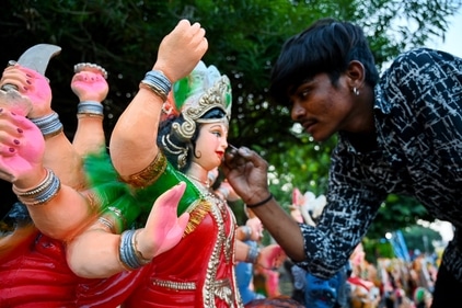 An artist gives final touches to Sherawali Mata ahead eve of the Navratri festival. (Photo by Sunil Ghosh / Hindustan Times)