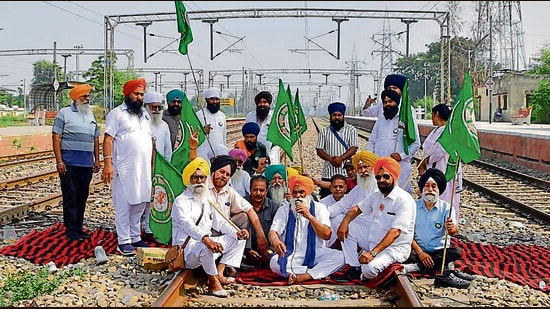 Farmers during a sit in at the Sahnewal railway station in Ludhiana on Thursday. (HT Photo)