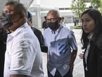 Ong Beng Seng, managing director of Hotel Properties Ltd., center, arrives at the State Courts in Singapore.