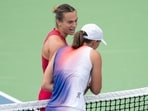 Aryna Sabalenka at the net with Iga Swiatek of Poland after their match on day seven of the Cincinnati Open