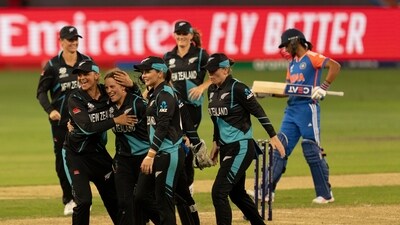 New Zealand team members congratulate Eden Carson, third from left, after she took the wicket of India's Smriti Mandhana during the ICC Women's T20 World Cup 2024 match between India and New Zealand at Dubai International Stadium (AP) New Zealand team members congratulate Eden Carson, third from left, after she took the wicket of India's Smriti Mandhana during the ICC Women's T20 World Cup 2024 match between India and New Zealand at Dubai International Stadium (AP)