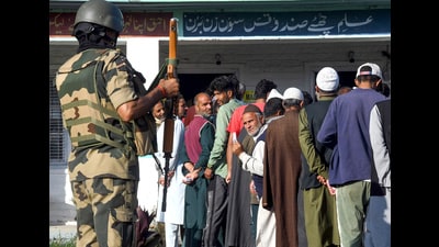 Jammu and Kashmir, Oct 01 (ANI): Security personnel stand guard as voters wait in queues to cast their votes for the final phase of the Jammu and Kashmir Assembly elections, on Tuesday. (ANI Photo) (ANI) Jammu and Kashmir, Oct 01 (ANI): Security personnel stand guard as voters wait in queues to cast their votes for the final phase of the Jammu and Kashmir Assembly elections, on Tuesday. (ANI Photo) (ANI)