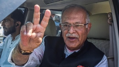 Jammu and Kashmir Congress unit chief Tariq Hameed Karra shows a victory sign after filing nomination papers from the Central Shalteng. (ANI) Jammu and Kashmir Congress unit chief Tariq Hameed Karra shows a victory sign after filing nomination papers from the Central Shalteng. (ANI)