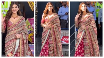 Kriti Sanon donned a Tarun Tahiliani saree. The saree had intricate embroidery work. She paired it with a red blouse, that matched the saree's shades of red and pink. The blouse was the statement piece as it had golden, dangling embellishments along the sleeves. She accessorised with a classy red gemstone necklace. (Instagram/@varindertchawla) Kriti Sanon donned a Tarun Tahiliani saree. The saree had intricate embroidery work. She paired it with a red blouse, that matched the saree's shades of red and pink. The blouse was the statement piece as it had golden, dangling embellishments along the sleeves. She accessorised with a classy red gemstone necklace. (Instagram/@varindertchawla)