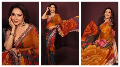 Madhuri Dixit embraced a floral look with her saree, which featured warm tones and stunning floral motifs along the pallu. Accented with green, pink, and red, the saree was truly gorgeous. She paired it with dangling jhumkas and sported a glamorous makeover to complement the ensemble. (Instagram/@madhuridixit) Madhuri Dixit embraced a floral look with her saree, which featured warm tones and stunning floral motifs along the pallu. Accented with green, pink, and red, the saree was truly gorgeous. She paired it with dangling jhumkas and sported a glamorous makeover to complement the ensemble. (Instagram/@madhuridixit)