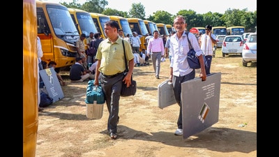 Rohtak: Polling officials carry EVM and other election material as they leave for their respective polling stations on the eve of the Haryana Assembly elections, in Rohtak, Haryana, Friday, Oct 4, 2024. (PTI Photo)(PTI10_04_2024_000200A) (PTI) Rohtak: Polling officials carry EVM and other election material as they leave for their respective polling stations on the eve of the Haryana Assembly elections, in Rohtak, Haryana, Friday, Oct 4, 2024. (PTI Photo)(PTI10_04_2024_000200A) (PTI)