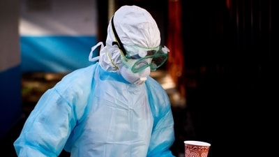 M medical worker from the Infection Prevention and Control unit wearing full protective equipment carries a meal to an isolation tent housing a man being quarantined after coming into contact in Uganda with a carrier of the Marburg Virus, at the Kenyatta National Hospital in Nairobi, Kenya. (AP Photo/Ben Curtis, File) (AP) M medical worker from the Infection Prevention and Control unit wearing full protective equipment carries a meal to an isolation tent housing a man being quarantined after coming into contact in Uganda with a carrier of the Marburg Virus, at the Kenyatta National Hospital in Nairobi, Kenya. (AP Photo/Ben Curtis, File) (AP)