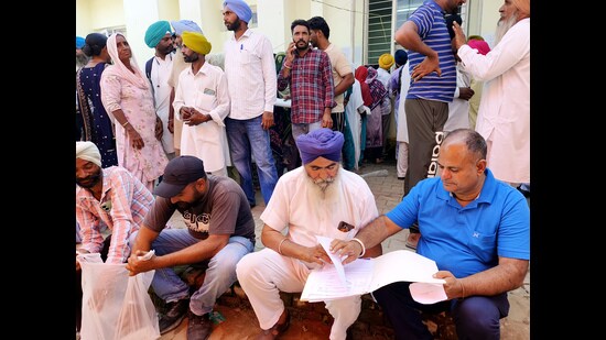Candidates check their documents before filing the nomination papers in Patiala on Friday. (ANI)