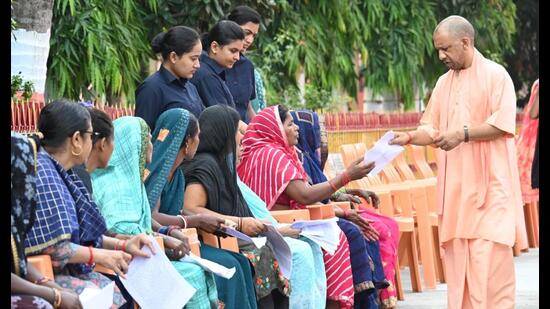 UP CM Yogi Adityanath listening to people’s problems at Janata Darshan event in Gorakhpur on October 4. (HT photo)