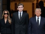 Former President Donald Trump, center right, stands with his wife Melania, second left, their son Barron, center left as the coffin carrying the remains of Amalija Knavs, the former first lady's mother, is carried into the Church of Bethesda-by-the-Sea for her funeral, Thursday, Jan. 18, 2024, in Palm Beach, Fla. (AP Photo/Rebecca Blackwell) Former President Donald Trump, center right, stands with his wife Melania, second left, their son Barron, center left as the coffin carrying the remains of Amalija Knavs, the former first lady's mother, is carried into the Church of Bethesda-by-the-Sea for her funeral, Thursday, Jan. 18, 2024, in Palm Beach, Fla. (AP Photo/Rebecca Blackwell)