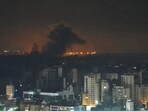 Smoke rises after an Israeli airstrike that targeted a neighborhood in Beirut's southern suburbs.