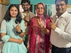 Jhajjar: Paris Olympics medallist shooter Manu Bhaker and her family members show their fingers marked with indelible ink after casting vote at a polling station during the Haryana Assembly elections, in Jhajjar, Saturday, Oct. 5, 2024. (PTI Photo)