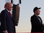 Tesla CEO and X owner Elon Musk speaks as Republican presidential nominee and former U.S. president Donald Trump looks on during a rally at the site of the July assassination attempt against Trump, in Butler, Pennsylvania, U.S., October 5, 2024. REUTERS/Brian Snyder