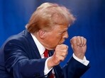 Republican presidential nominee and former U.S. President Donald Trump gestures at the end of a town hall as he campaigns in Fayetteville, North Carolina, U.S. October 4, 2024.  