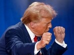 Republican presidential nominee and former U.S. President Donald Trump gestures at the end of a town hall as he campaigns in Fayetteville, North Carolina, 