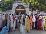 Women voters wait outside a polling booth to cast their votes during the Haryana Assembly Election at Raipur village in Nuh, Mewat, in Gurugram on Saturday. (Parveen Kumar/HT PHOTO)