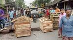Irate villagers block a road as they stage a protest after the alleged murder of a 9-year-old girl in Kultali area of South 24 Parganas district on Saturday. (PTI)