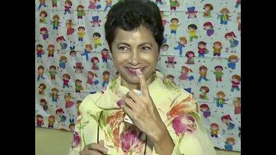 Congress MP Kumari Selja showing her inked finger after casting her vote at a polling station in Hisar on Saturday. (PTI Photo)
