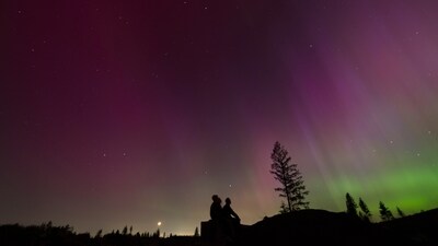 In this image taken with a long exposure, people look at the night sky towards the northern lights, or Aurora Borealis, May 10, 2024, in Estacada, Ore. (AP Photo/Jenny Kane, File) (AP) In this image taken with a long exposure, people look at the night sky towards the northern lights, or Aurora Borealis, May 10, 2024, in Estacada, Ore. (AP Photo/Jenny Kane, File) (AP)