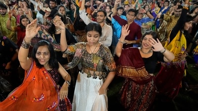 People wearing traditional attire perform Garba, a traditional dance of Gujarat state, on the second night of Navratri, or nine night festival, in Ahmedabad, India. (AP) People wearing traditional attire perform Garba, a traditional dance of Gujarat state, on the second night of Navratri, or nine night festival, in Ahmedabad, India. (AP)