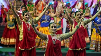Artists performs during an inauguration of Navratri or nine night festival in Ahmedabad. (AP) Artists performs during an inauguration of Navratri or nine night festival in Ahmedabad. (AP)