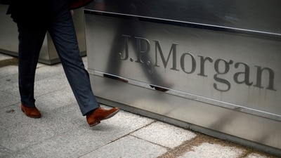 A man walks into the JP Morgan headquarters at Canary Wharf in London May 11, 2012. (Dylan Martinez/Reuters)