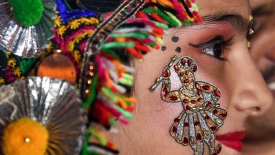 A girl with her face tattooed during performance of 'garba' dance on the first day of Navratri festival, in Mumbai. (PTI) A girl with her face tattooed during performance of 'garba' dance on the first day of Navratri festival, in Mumbai. (PTI)