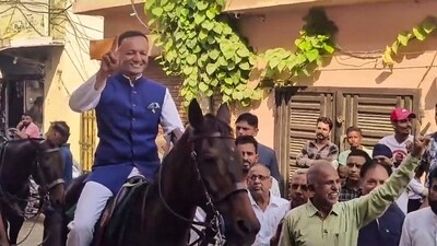 BJP leader Naveen Jindal arrives at a polling station riding horse to cast his vote for Haryana Assembly polls, in Kurukshetra (PTI) BJP leader Naveen Jindal arrives at a polling station riding horse to cast his vote for Haryana Assembly polls, in Kurukshetra (PTI)