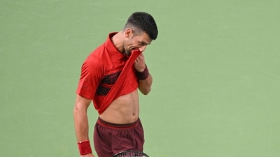 Serbia's Novak Djokovic reacts to a point during his men's singles match against USA's Alex Michelsen at the Shanghai Masters tennis tournament in Shanghai on October 5, 2024. (AFP) Serbia's Novak Djokovic reacts to a point during his men's singles match against USA's Alex Michelsen at the Shanghai Masters tennis tournament in Shanghai on October 5, 2024. (AFP)
