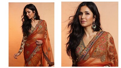 Katrina Kaiff shows orange is the brighest colour of them all in this lovely saree. This sheer number came with a beautiful multi-colour border and a blouse with plunging neckline. Katrina Kaiff shows orange is the brighest colour of them all in this lovely saree. This sheer number came with a beautiful multi-colour border and a blouse with plunging neckline.