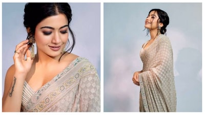Rashmika Mandanna's grey-beige saree is the perfect example of understated glam. The self-work and the light border make it dainty choice for your pujo festivities. Rashmika Mandanna's grey-beige saree is the perfect example of understated glam. The self-work and the light border make it dainty choice for your pujo festivities.
