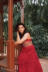 Saiyami looks radiant in a red strapless gown from Ritu Kumar