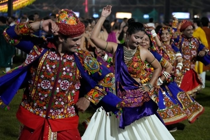 Feeling exhausted is natural because garba involves wearing heavy ethnic outfits, jewellery, spinning around in circles. (AP Photo/Ajit Solanki) Feeling exhausted is natural because garba involves wearing heavy ethnic outfits, jewellery, spinning around in circles. (AP Photo/Ajit Solanki)