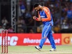 India's Varun Chakravarthy celebrates the wicket of Bangladesh's Towhid Hridoy.