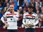 Christian Eriksen, left, and Manchester United's Bruno Fernandes react during the English Premier League soccer match between Aston Villa and Manchester United, at Villa Park in Birmingham, England.