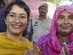 Congress candidate from Julana Vinesh Phogat and her mother Premlata after casting their votes. (PTI Photo)