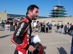 Keanu Reeves walks in the garage area following a GR Cup Series auto race at Indianapolis Motor Speedway, Saturday
(AP Photo/Darron Cummings)