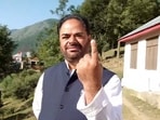 Congress candidate from Banihal constituency Vikar Rasool Wani shows his finger marked with indelible ink after casting his vote during the first phase of Jammu and Kashmir Assembly elections.