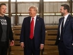 Former US President Donald Trump, center, and Senator JD Vance, right, a Republican from Ohio and Republican vice-presidential nominee, greet Elon Musk, chief executive officer of Tesla Inc., backstage prior to a campaign event at the Butler Farm Show in Butler, Pennsylvania, US, on Saturday, Oct. 5, 2024. Elon Musk will campaign with the former president on Saturday, joining a rally at the scene of a summer assassination attempt and cementing his role as one of the Republican candidate's key backers. Photographer: Justin Merriman/Bloomberg