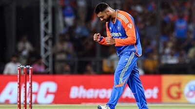 India's Varun Chakravarthy celebrates the wicket of Bangladesh's Towhid Hridoy. (BCCI - X)